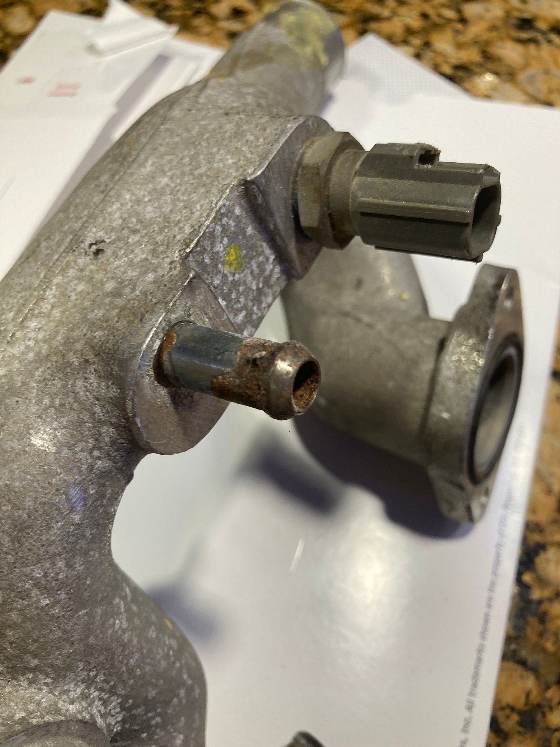 This is from a 2002 XJR as it has a metal pressed in pipe. My daughter�s 98� XJR has molded in aluminum like yours has. I believe only the AJ26S engines have an all aluminum molded one vs the AJ27S with a pressed in one. 