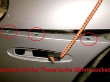 Location of the three bolts holding the bumper cover on. Also, using the bungee cords to hold the bumper cover from falling.
