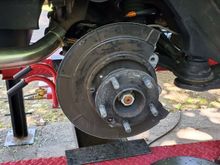 This is the modified stock backing plate, I used a nibbler to get the bent edge part cut down as much as I could and then cut out for the caliper. I had the rear ones as well for the Brembo set but things were not moving easily and after the first bolt broke I decided it wasn't worth it. 