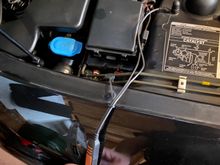 + on left. - on right attached to strut mount bolt