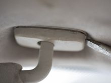 Unclip cover to reveal screws.