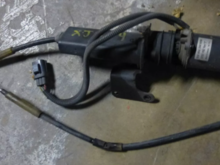 Photo from a fleabay seller. Surprisingly selling what appears to be a RH parkbrake cable (for the Brembo setup) along with the actuator. However, I can't be certain that its not the LH cable. Most sellers are just offering the actuator. The bend in this (assumed) RH parkbrake cable shown is where it's secured by the bolt/bracket in question. 
