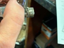 Broken stud that pulled out of rear hub when the sloppy welding job let loose.