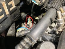 I took this from the passenger side and this is the location of the electrical connectors for both of the drivers side oxygen sensor. 