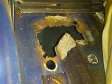 Rusty floor in 2004 XK8, why does Jaguar install that water and grit trap right by the front wheel splash area.