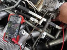 0.6second view of measuring continuity of white wire from Pin 18 and the opposite end of the white wire at the engine