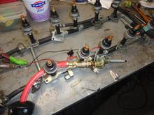 Compressed air line and blow gun. Fitting and hose used to blank off the other fuel line to the rail is seen at the top.