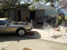 Larry's car up on the patio,with My Jag looking on