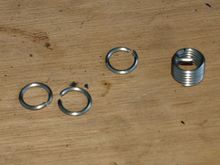 Helicoil shortened. Must not be longer than threaded part of nut.
