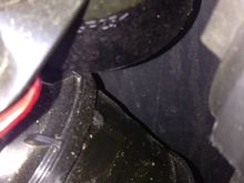 Bottom of canister in top of picture. Part of air intake tube in lower part of picture. Both have signs of the same "stuff" that looks like it has been sprayed on (no dripping/running). It's not much and hard to see.