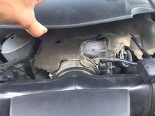 lifting the cover lightly with my thumb