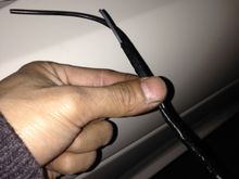 Get yourself about 7 inches of a metal hanger. Tape your wire to the hanger on one side depending if your running up or down the boot. I decided to go down.

feed it through the first opening. Then half way in that loom cut a small slit so you can poke the tip through. Do it gently and watch out for the other wires.

Mine went through smooth first try

After that you will be able to reach the end though that middle slit