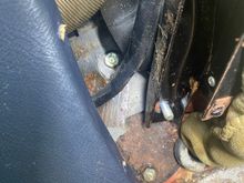 With console loosened and pulled rearwards you can access the 2 fixings to the cover plate.