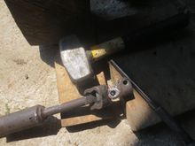 With one bit on a bit of wood and the other on a lower bit, I whacked the pin the bearings go over, out of the bracket. Onced set up, this was surprisingly easy.