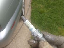 Too much dielectic grease on Cyl #1 spark plug. I also filled the ignition coil boot. Would this much resistance cause the melting shown in photo #2?