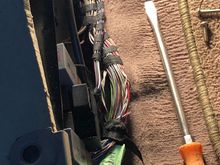 So if you want to tap into the rear right speaker you can do it from the passenger rear floor just remove the cover and find the pink/green wire that is twirled with the black and white wire