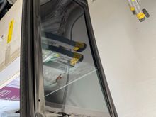 Underside of glass, showing mounting bracket.