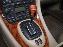 The plastic bezel isn’t connected to the metal gear shift frame so either the clips or the whole bezel would work. 