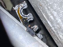 Zoomed in a bit. Hose connection with the issue is quite obvious with orange caked around the clamp.
It is over the edge of the under engine cover.