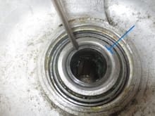 The steel ponter is on the hub tube and the blue line shows the inner hub bearing inner race.