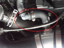 Went to the autoparts store, and got a small hose with a 90 degree bend, cut it to size and mated the to ends with a 90 degree elbow (will replace that PVC elbow with brass fittings when I find the correct size)