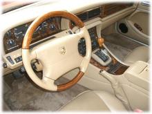 Autolux leather, polished burl walnut and lambswool carpets, Coffee with Cream trim. J-gate. No glove box.