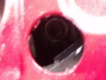 The differential fill plug is clearly visible.  My camera angle is to the right of the hole, so it appears there is more clearance on the left side than there actually is, thus I should have cut the hole slightly more to the left.