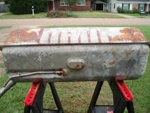Tank out of vehicle, front and top-facing sides.