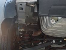 The empty hole left from the removed muffler