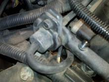 what is this device on the end of the fuel rail?  The hose appears to be going into our out of the throttle body.
