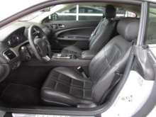 Unperforated leather seats=synthetic leather for door panels, dash, etc.