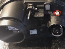 Circled white screw alters the dipped lights...where is the adjustment for the high beam ?