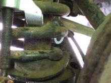 Bottom of spring out of perch.