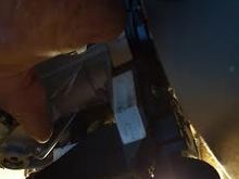 View from Top. Steering wheel on right; dash on left. See the hole in front of finger- this is where left rear screw comes in from underneath.  other rear is ez to see from underneath.