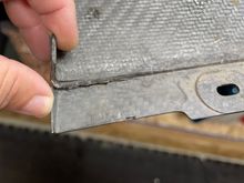 Pre-existing damage.  I think this could be fixed with some epoxy, and it's way under the car where no one would see it unless they're on their back.