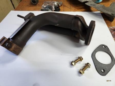I had to cut the studs off the flange that attaches to the exhaust pipe....drilled out the studs, cut a new gasket with my last piece of exhaust gasket material I had...bolts will actually make fitting easier.