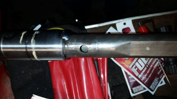 Steering shaft stripped of the electrics.  Hole is where the black plastic insulator halve go.