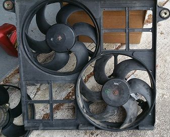vdp 97 fan shroud, "new" fan from ebay for 98 on lower right. golts and wiring are same, but diameter is bigger by 4" so won't sit in shroud. 