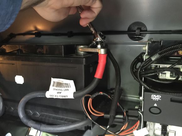 26. Next the positive terminal connector comes off, the same way. Be careful not to short the positive terminal to the car.