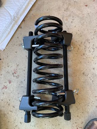 The strut compression tool I borrowed.  Note the shock is not included so I could better show the large clamps