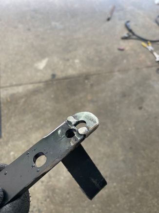 Shifter bracket after welding a washer to catch new hole.  