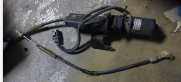 Photo from a fleabay seller. Surprisingly selling what appears to be a RH parkbrake cable (for the Brembo setup) along with the actuator. However, I can't be certain that its not the LH cable. Most sellers are just offering the actuator. The bend in this (assumed) RH parkbrake cable shown is where it's secured by the bolt/bracket in question. 