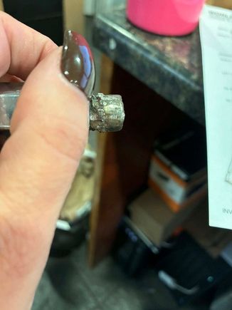 Broken stud that pulled out of rear hub when the sloppy welding job let loose.