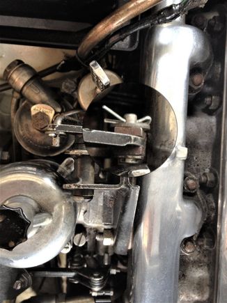 Cass3958 rear carb with magnifying loop around the clevis pin attachment to kick down cable