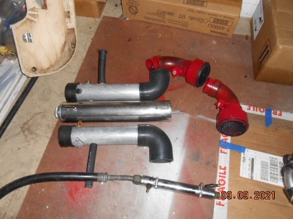 Cold air intake pipes with elbows.
In the middle is the vertical overflow tank