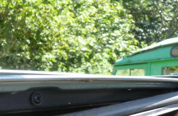 5 screws located at the leading edge of the sunroof secure the outer panel in place.