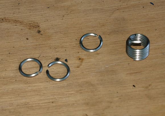 Helicoil shortened. Must not be longer than threaded part of nut.