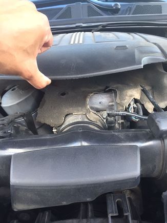 lifting the cover lightly with my thumb