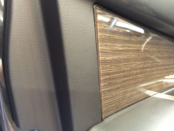 Front driver wood trim sticking out. Goes in about 1/4" but takes a lot of force.