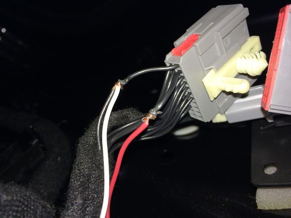 Here is where I poked the new wires through the loops and rapped them around before soldering and re-insulating. Doing it this way keep the integrity of the factory wiring while providing positive connections and better yet, everything lays back down in the original wiring path.